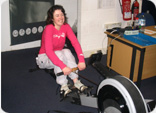 Julie on a rowing machine