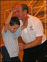 Peter teaching trampolining to a young student
