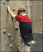 Man on climbing wall