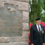 4 June 2004. Pat Kelly, at the 11th Armoured Division Memorial, Flers, Normandy. The Memorial was unveiled by the Division's CO, Major General 'Pip' Roberts in 1974. The sculpture displays the Division's insignia of 'The Black Bull'. The Division charged from Normandy to the Baltic. 4 June 2004. Pat Kelly, at the 11th Armoured Division Memorial, Flers, Normandy. The Memorial was unveiled by the Division's CO, Major General 'Pip' Roberts in 1974. The sculpture displays the Division's insignia of 'The Black Bull'. The Division charged from Normandy to the Baltic.
