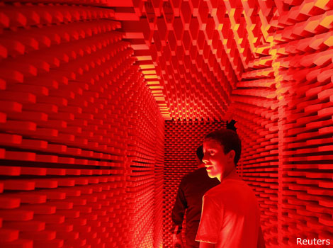 People visiting an echo-free chamber in Valetta.