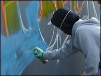 One of the graffiti artists at work