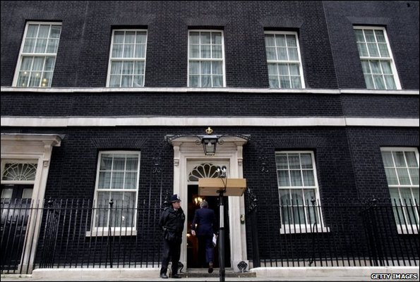 Gordon Brown goes back into Downing Street after announcing his resignation as Labour leader