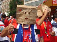 A supporter with a bag on his head...