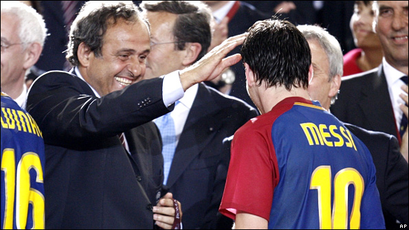Michel Platini congratulates Lionel Messi