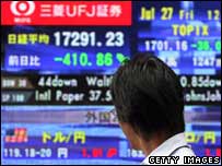 Man looking at stock market figures