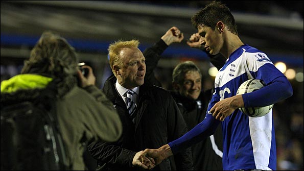 McLeish shakes the hand of Zigic at the end of the match
