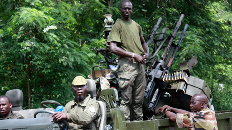 Picture showing armed men in a truck