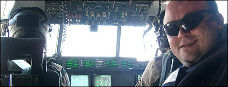 Toby Foster in the cockpit of a Hercules aircraft