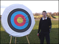 Boy with archery target