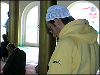 Muslim man praying in a mosque