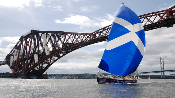 Edinburgh Inspiring Capital flying a Saltire spinnaker on the River Forth