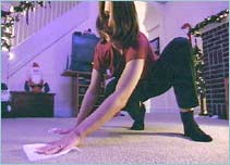 Stephanie cleaning the carpet