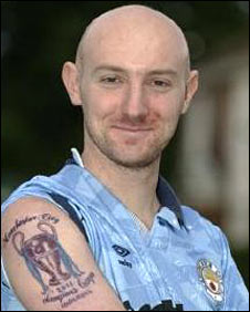 Kirk Bradley and his tattoo (pic credit News Team International) 