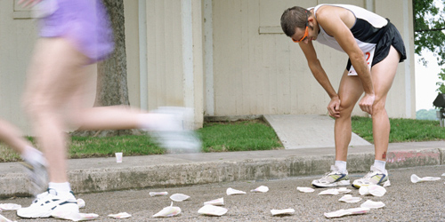A runner stops to take a breath