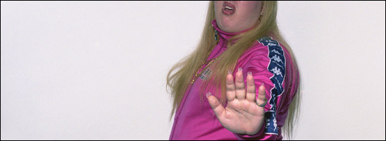 A young woman holding out her hand