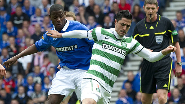 Rangers' Maurice Edu and Celtic's Beram Kayal battle for possession during one of last season's Old Firm matches