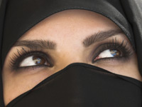 Muslim woman in niqab, with only her eyes showing. iStockphoto/Billie Muller