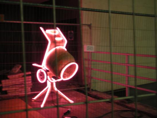 Completely non-traditional Christmas lights on a building site.