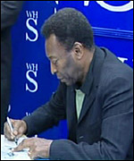Pele signing books