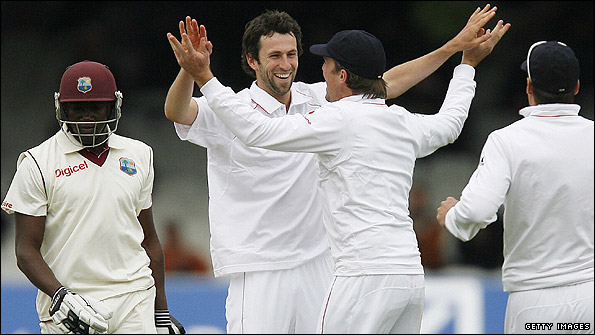 Graham Onions celebrates as Jerome Taylor marches off