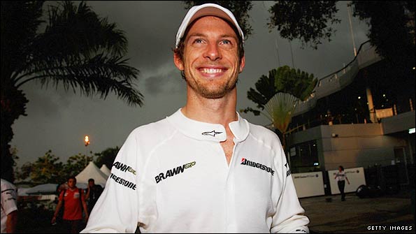 Jenson Button celebrates in the paddock