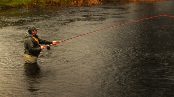 Ally Gowans fishing, while waist deep in water
