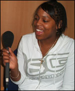 photo of Janita holding a radio microphone