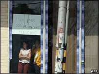 Hostages held in branch of the Banco Provincial in Altagracia de Orituco, in the state of Guarico, look out of the bank's windows