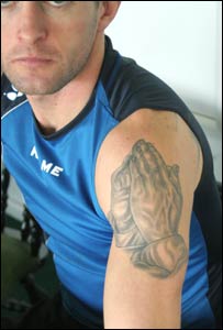 Nathan Jones' praying hands tattoo