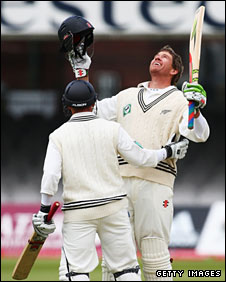 Jacob Oram is congratulated by Daniel Flynn on reaching his hundred