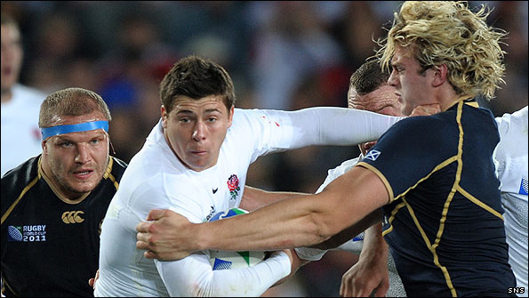 England scrum-half Ben Youngs is tackled by Scotland's lock Richie Gray as prop Euan Murray looks on during the 2011 Rugby World Cup