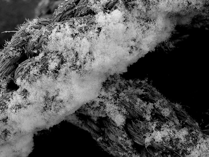 Closeup of snow on a rope