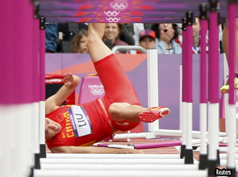 China's Liu Xiang falls at the first jump in the men's 110m hurdles. 
