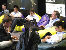 Men working on laptops