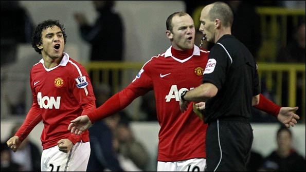 Rooney remonstrates with the the referee