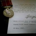 The medal and letter Olive recieved from the King at the end of the war.