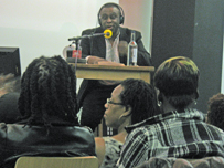 Dotun presides over the debate at Rich Mix