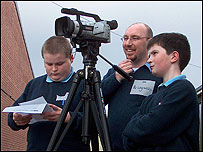 Filming a report during practice day