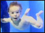 A baby swimming underwater