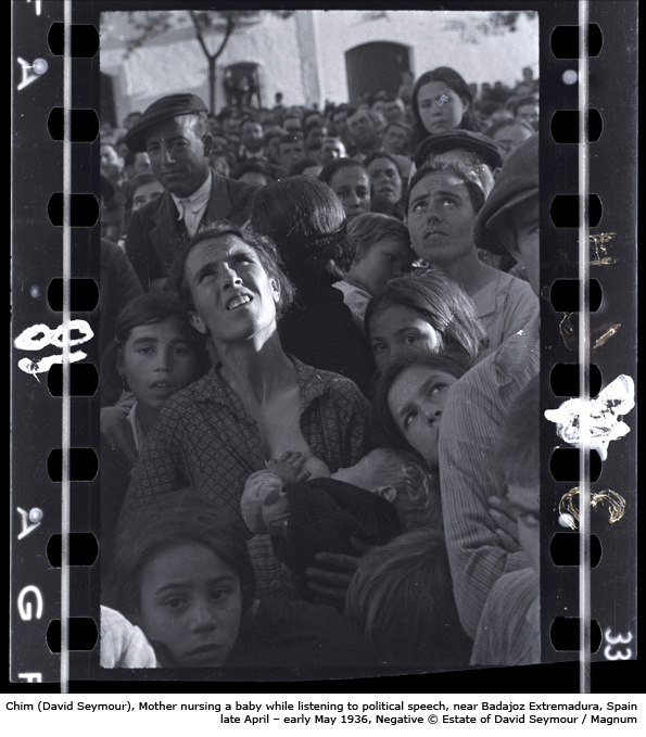 Chim (David Seymour), Mother nursing a baby while listening to political speech, near Badajoz Extremadura, Spain, late April - early May 1936, Negative © Estate of David Seymour / Magnum