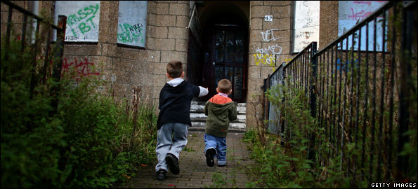 Two children in rundown area