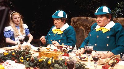 Alice dines with Tweedledee and Tweedledum (played by The Two Ronnies)