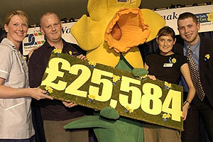 Paul persuades students to part with their loan cheque for charity...