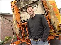 William Ivory behind a bin lorry