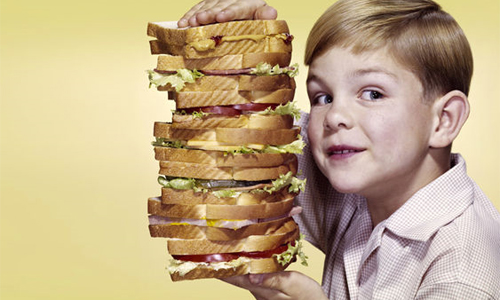 Boy with sandwiches