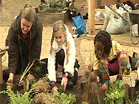 Children work in the educational garden