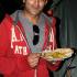 Adil grabs something to munch