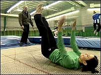 Jacey on trampoline learning stunts