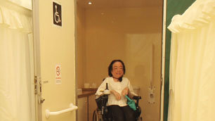 Liz showing off the wedding's accessible loo.